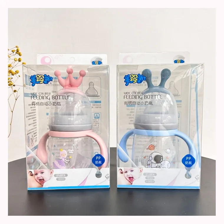 New 180ml anti-colic Crown baby bottle with handle, listed in pink, blue